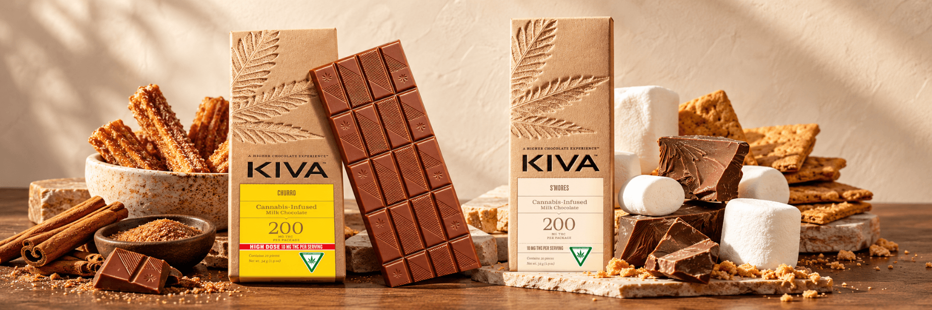 Kiva Churro and S’mores cannabis-infused milk chocolate bars displayed with their packaging.
