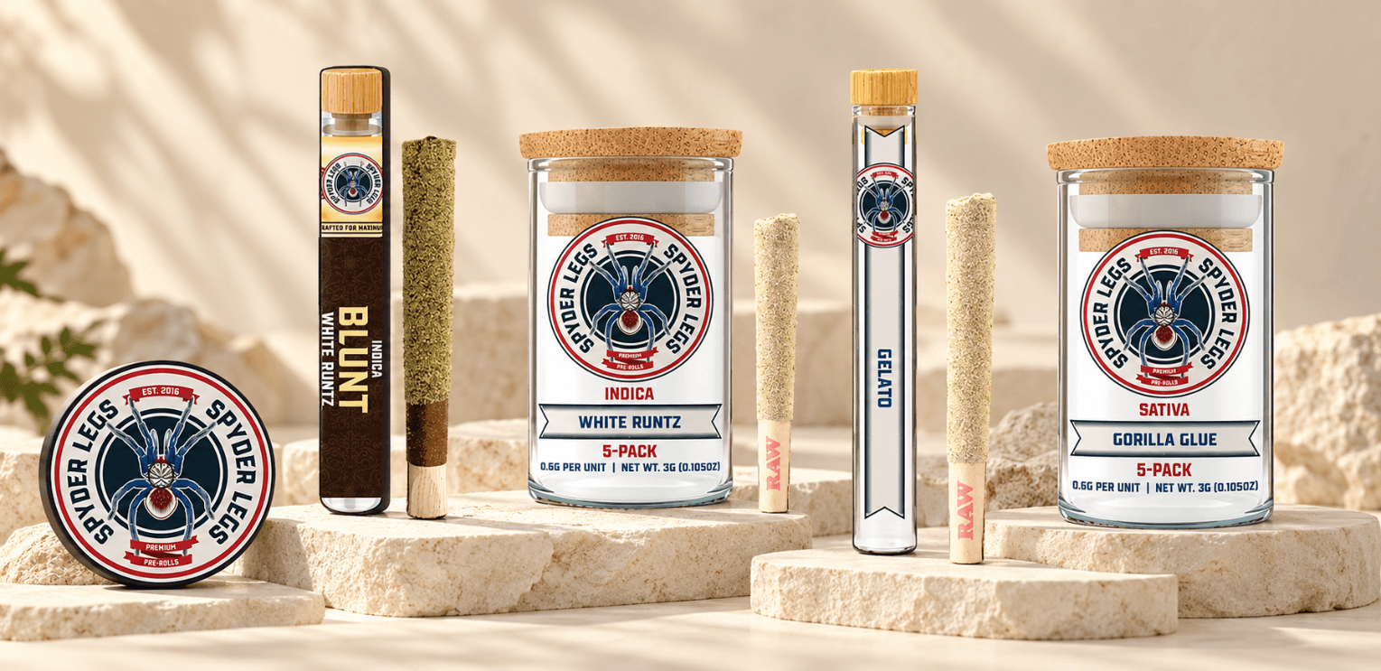 Spyder Legs White Runtz blunt, Gelato pre-roll and White Runtz and Gorilla Glue five-packs displayed on ivory stone platforms. Spyder Legs White Runtz blunt, Gelato pre-roll and White Runtz and Gorilla Glue five-packs displayed on ivory stone platforms.